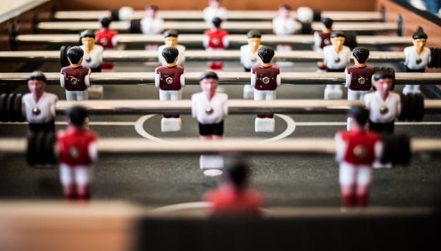 brown foosball table closeup photography
