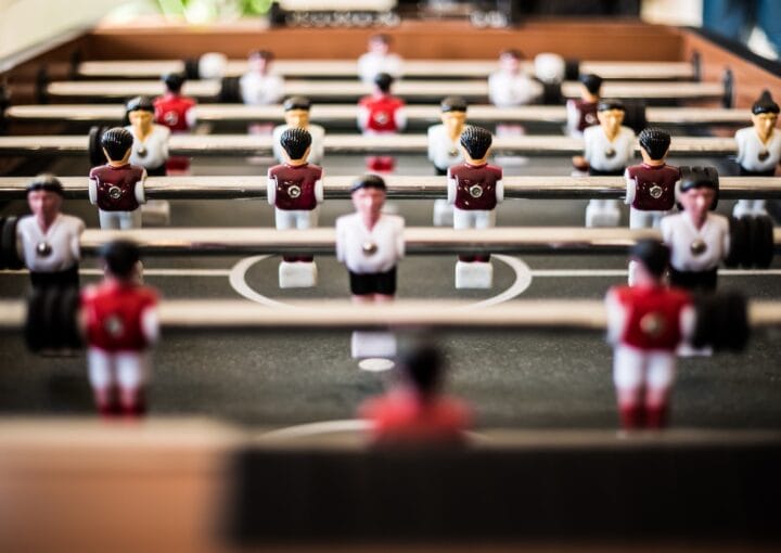 brown foosball table closeup photography